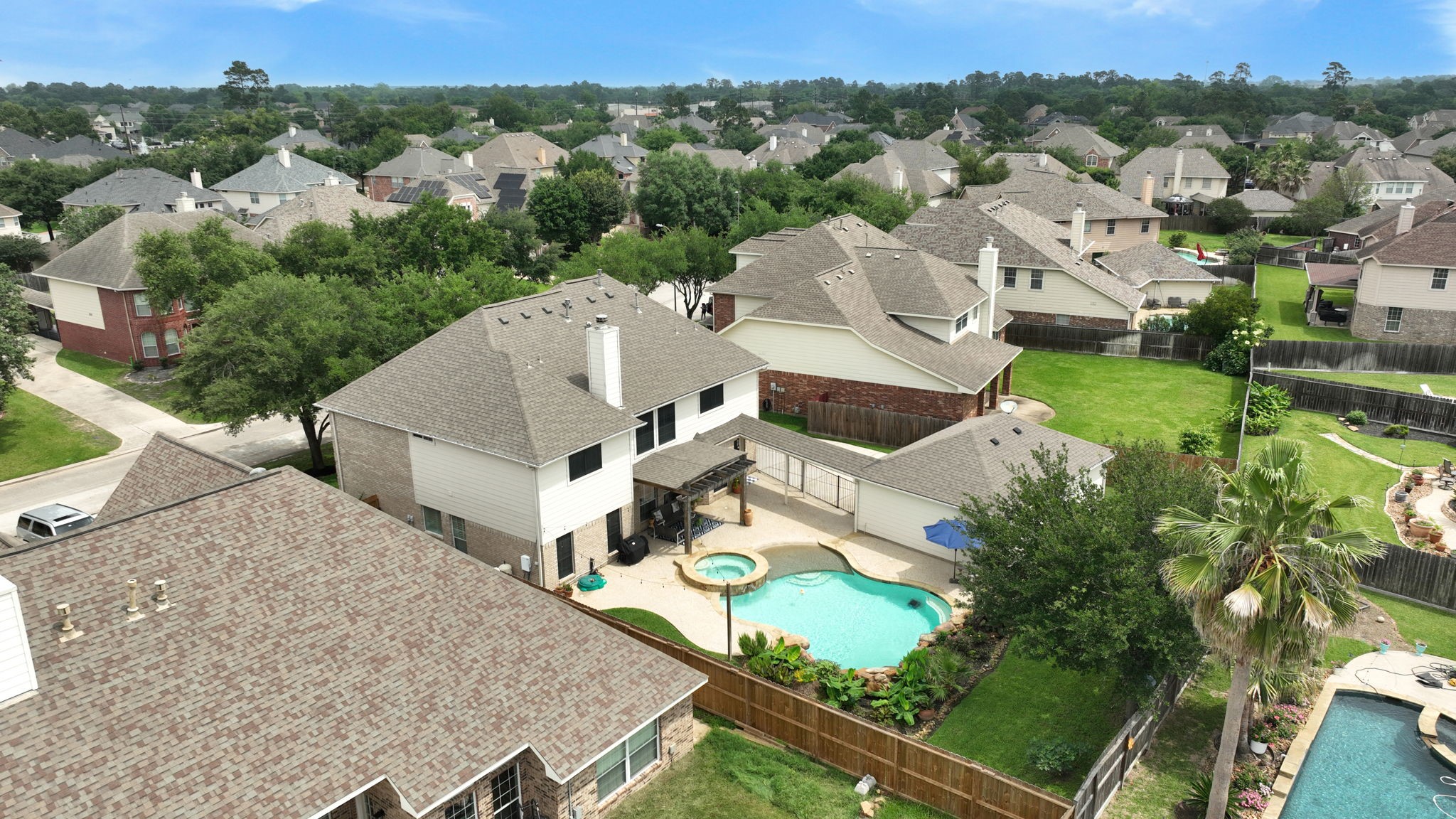 8419 Marchelle Lane Spring, TX 77379 - Photo 2 of 42 an aerial view of a house with a garden