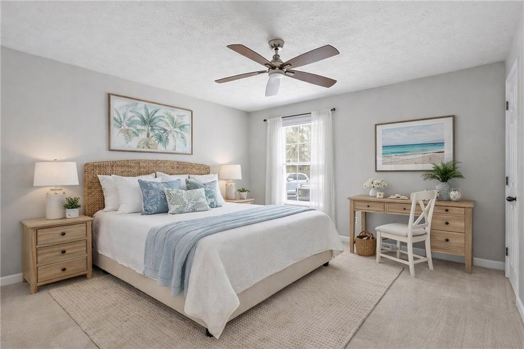 106 Berkeley Woods Drive Duluth, GA 30096 - Photo 11 of 17 a bed room with a bed and a chair