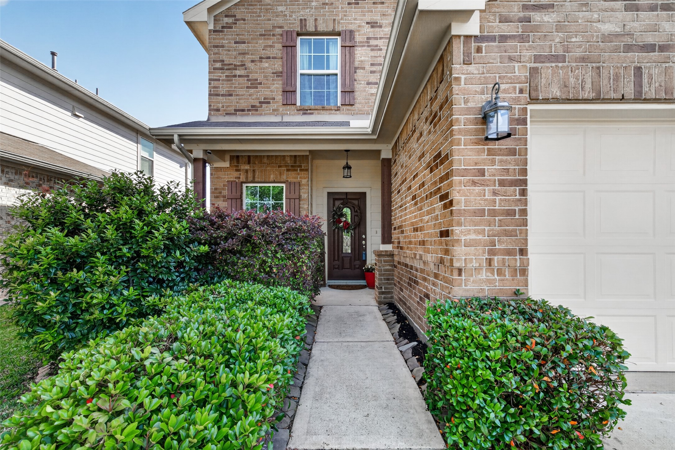 8630 Willet Street Baytown, TX 77521 - Photo 2 of 49 lush landscaped bushes and shrubs