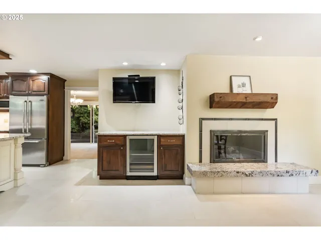 a living room with a fireplace and a flat screen tv