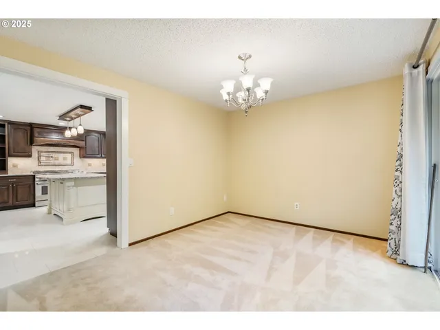 a view of a livingroom with a kitchen