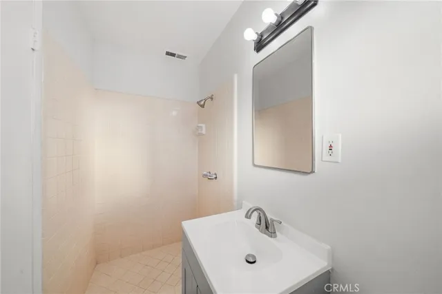 a bathroom with a sink and mirror