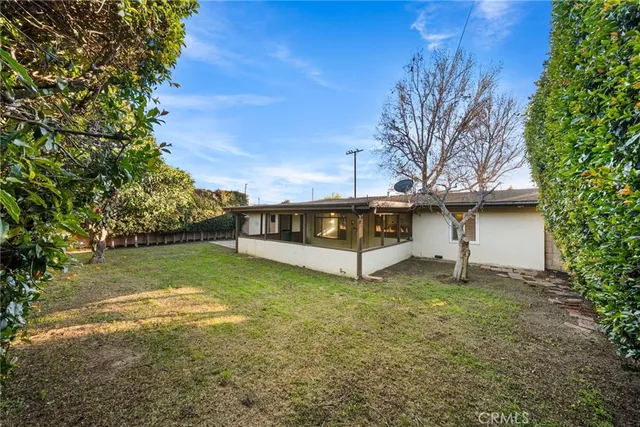 a house with trees in the background