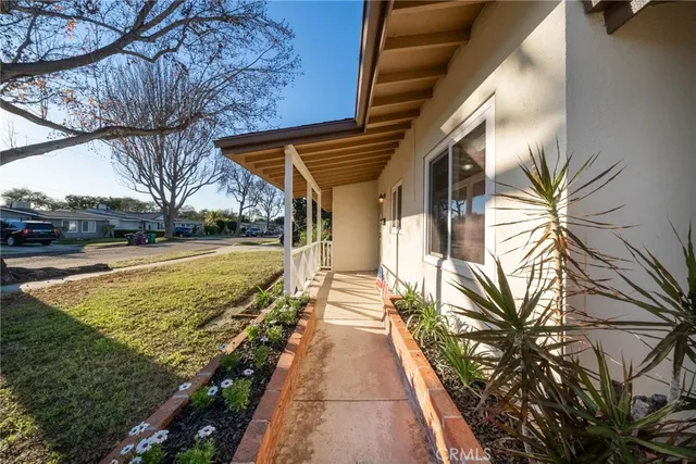 a view of a house with backyard and swimming pool