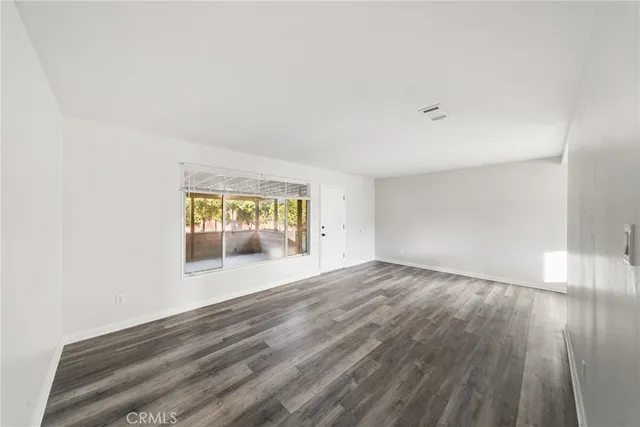 a view of an empty room and window