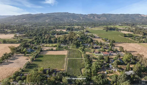 a view of a town with mountains in the background