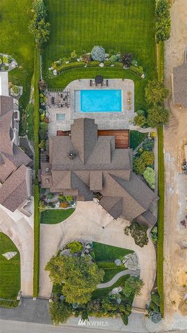 an aerial view of a house with outdoor space