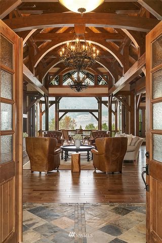 a view of living room with furniture and a floor to ceiling window