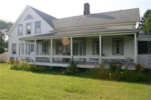 114 Hoyt Road Harwich, MA 02646 - Photo 1 of 12 a front view of a house with a garden and swimming pool