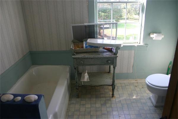 114 Hoyt Road Harwich, MA 02646 - Photo 12 of 12 a bathroom with a sink toilet and tub