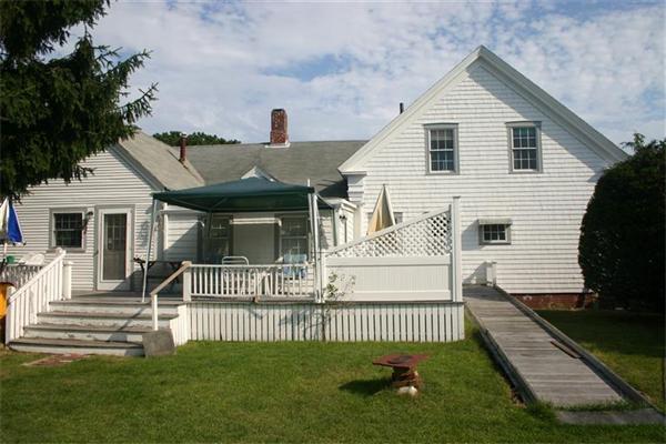 114 Hoyt Road Harwich, MA 02646 - Photo 2 of 12 a front view of a house with a garden