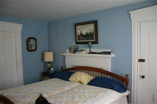 114 Hoyt Road Harwich, MA 02646 - Photo 7 of 12 a bedroom with a bed and a table in it