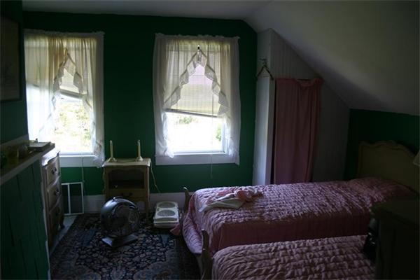 114 Hoyt Road Harwich, MA 02646 - Photo 9 of 12 a bedroom with a bed and a window