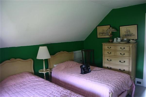 114 Hoyt Road Harwich, MA 02646 - Photo 10 of 12 a bed room with a bed and a chair