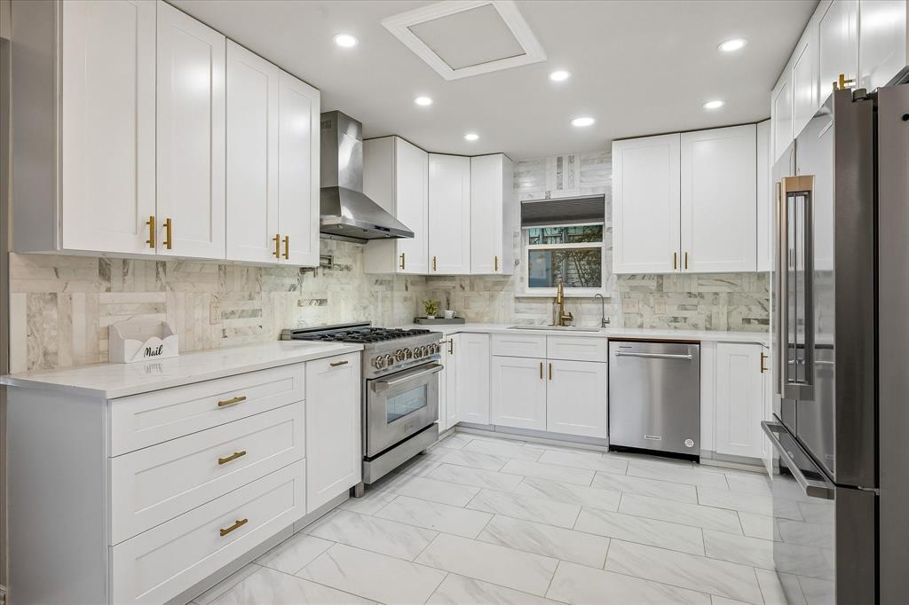 2001 Pebblebrook Trail Irving, TX 75060 - Photo 13 of 40 The completely renovated kitchen offers an upscale ZLine Gas Range, Pot Filler, and abundance of cabinets for storage!