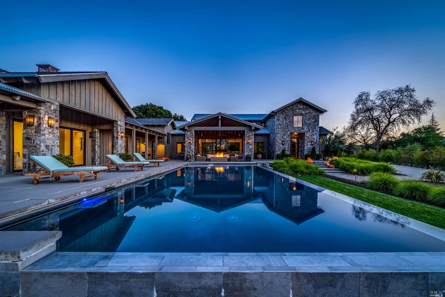 199 Zinfandel Lane St. Helena, CA 94574 - Photo 1 of 1 a front view of house and yard with swimming pool and outdoor seating