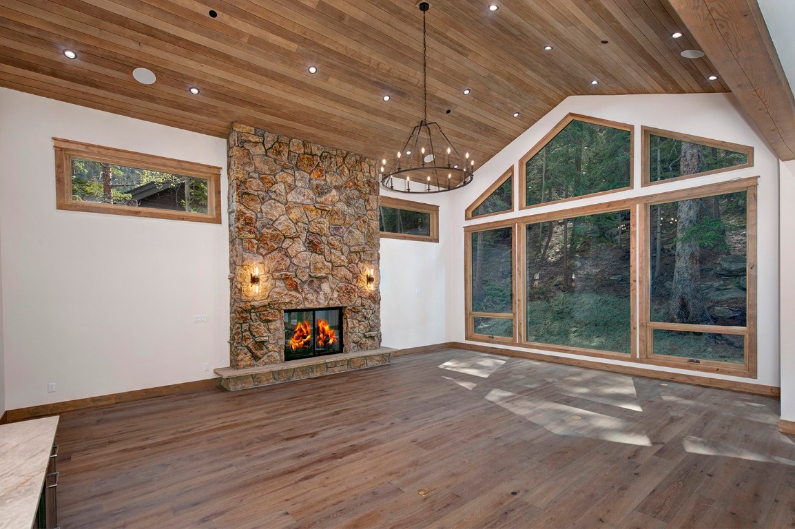 25 Tip Top Trail Keystone, CO 80435 - Photo 3 of 39 a view of an empty room with wooden floor and a window