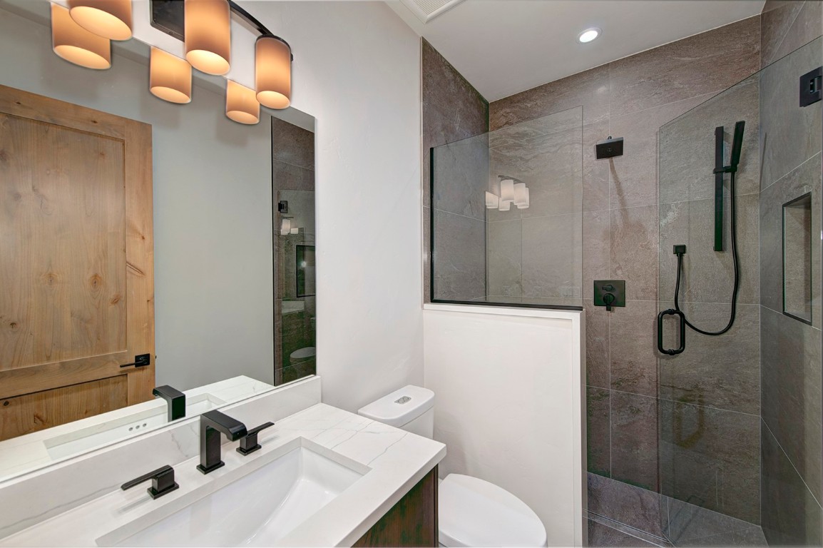 25 Tip Top Trail Keystone, CO 80435 - Photo 33 of 39 a bathroom with a sink vanity granite toilet and shower