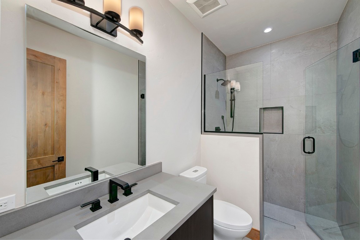 25 Tip Top Trail Keystone, CO 80435 - Photo 35 of 39 a bathroom with a sink a toilet and shower