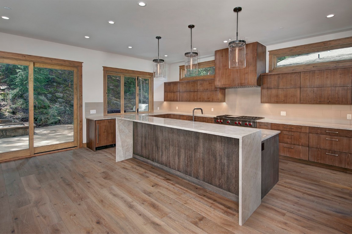 25 Tip Top Trail Keystone, CO 80435 - Photo 7 of 39 a kitchen with stainless steel appliances granite countertop a sink a stove and a wooden floor