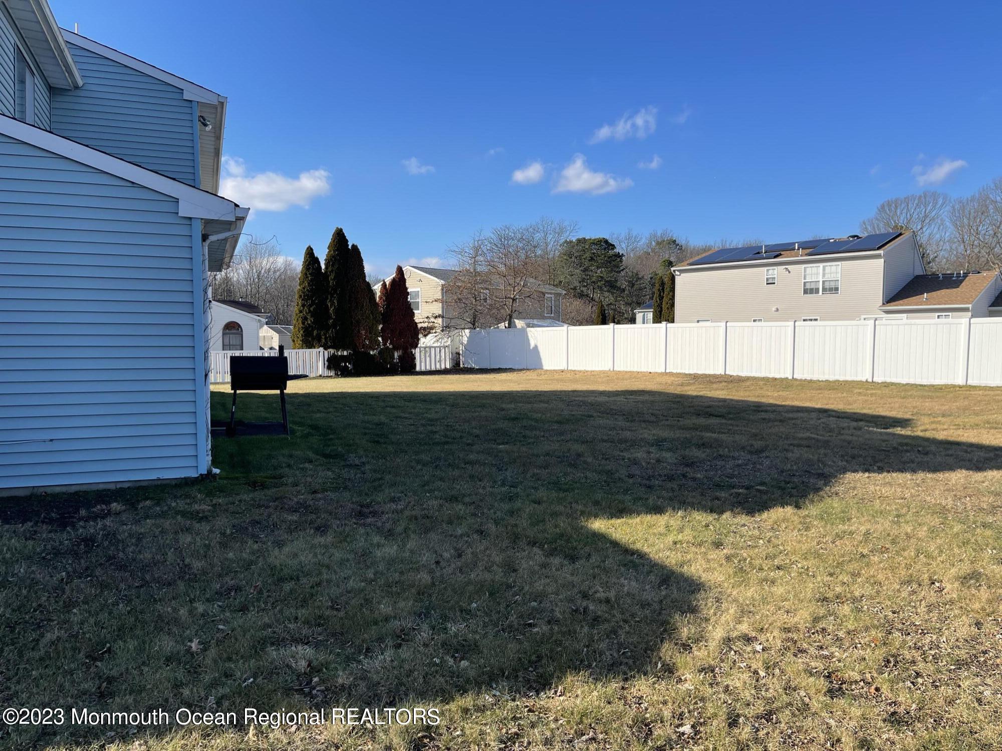 51 Cherry Bend Drive Howell, NJ 07731 - Photo 17 of 18 a view of a house with a yard