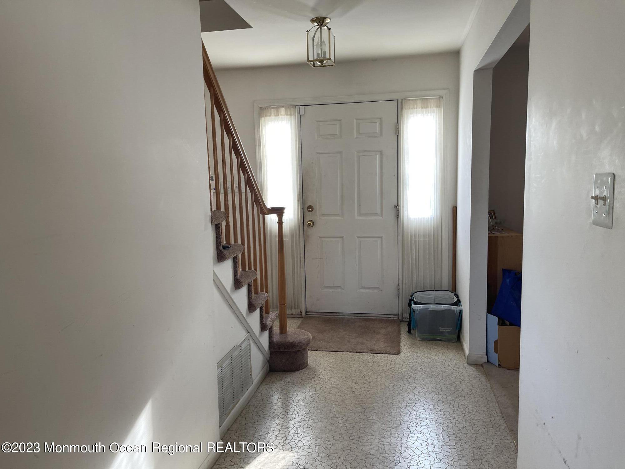 51 Cherry Bend Drive Howell, NJ 07731 - Photo 2 of 18 a view of a hallway with staircase