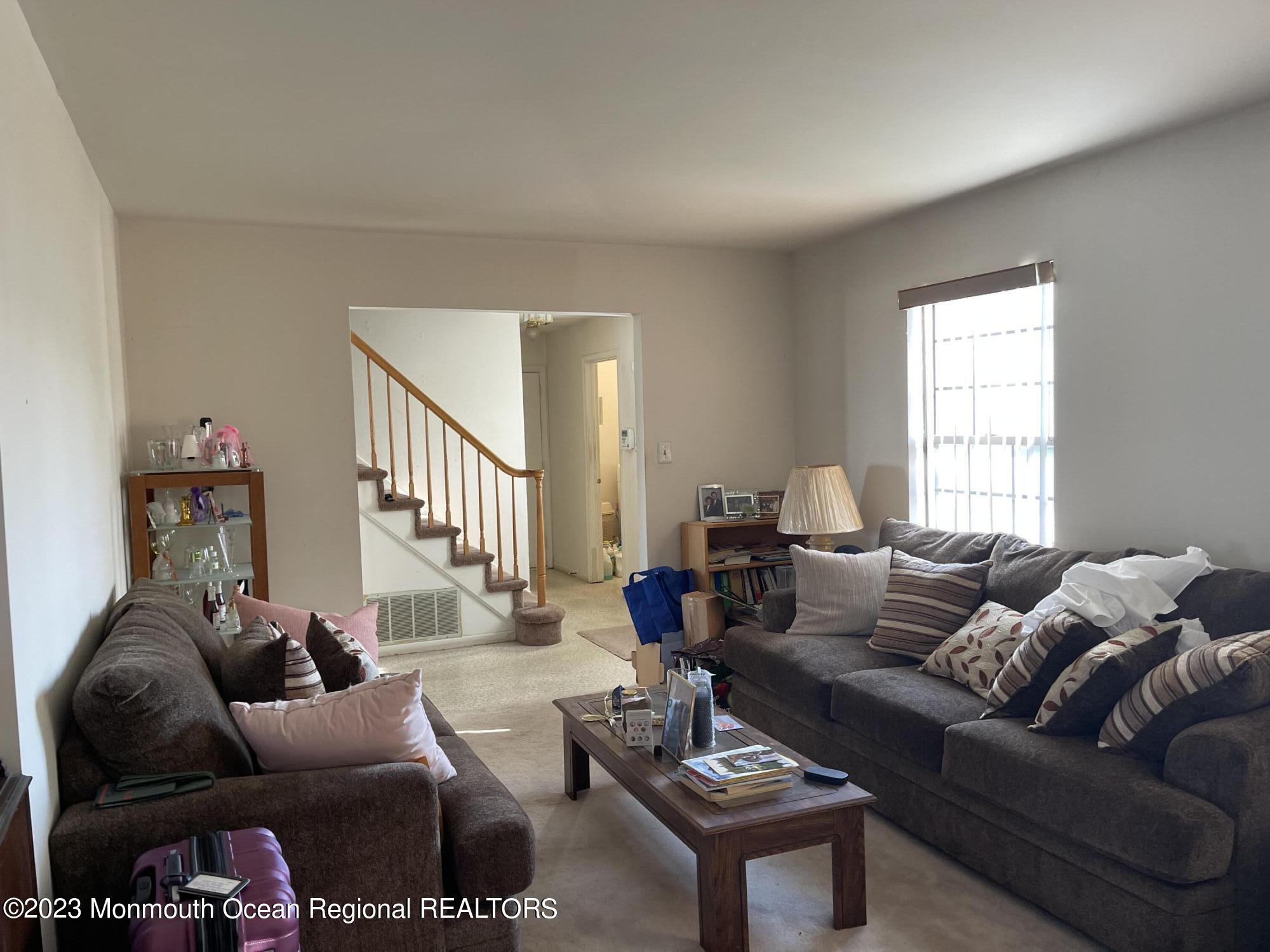 51 Cherry Bend Drive Howell, NJ 07731 - Photo 3 of 18 a living room with furniture and a window