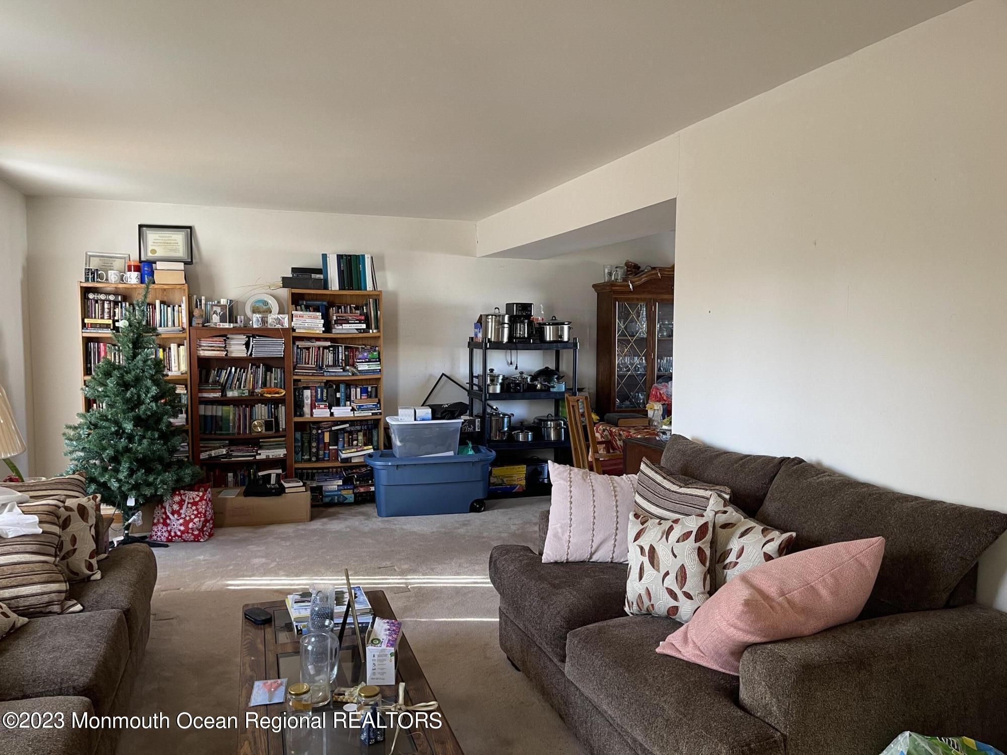 51 Cherry Bend Drive Howell, NJ 07731 - Photo 7 of 18 a living room with furniture workspace and a potted plant