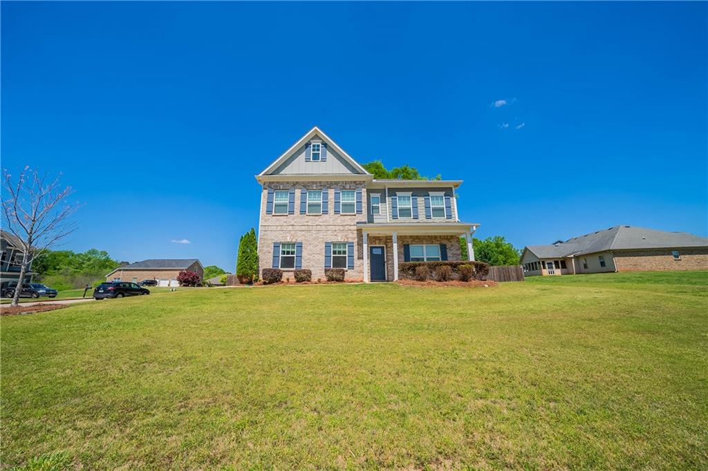 10 Edgewater Court Covington, GA 30016 - Photo 1 of 25 a big house with a big yard and large trees