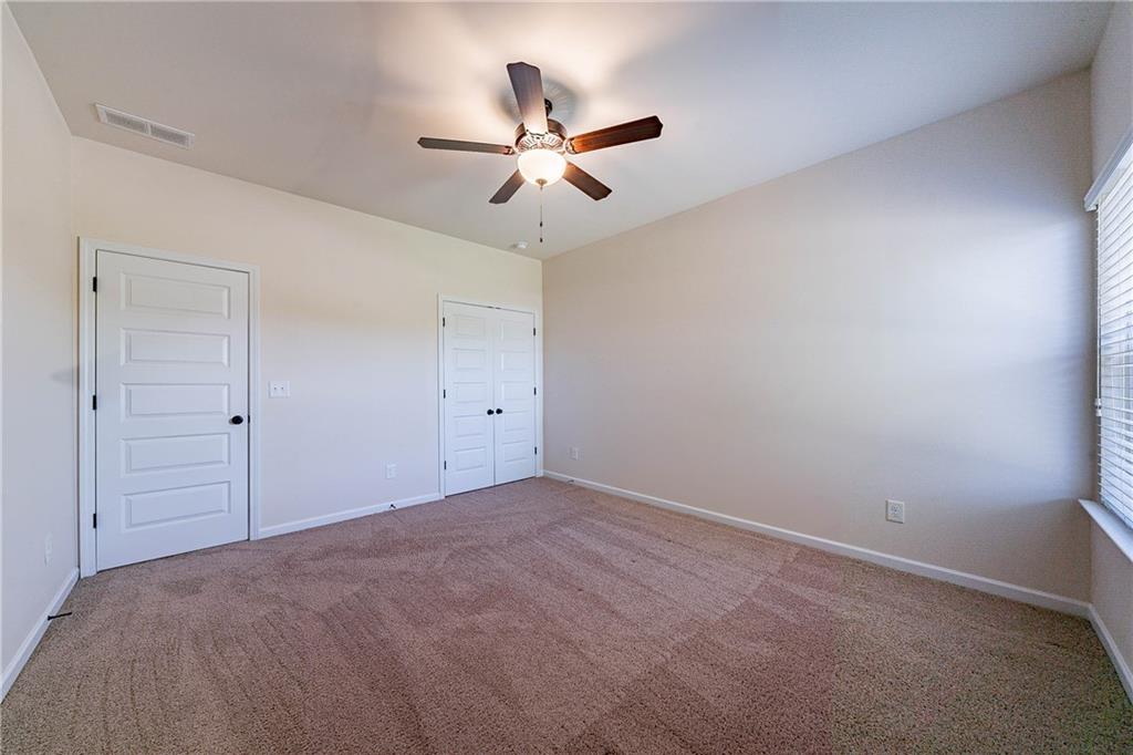 10 Edgewater Court Covington, GA 30016 - Photo 17 of 25 a view of a ceiling fan in a room