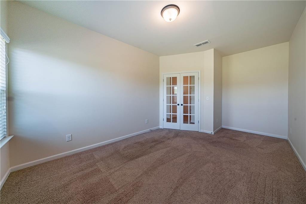 10 Edgewater Court Covington, GA 30016 - Photo 19 of 25 an empty room with windows