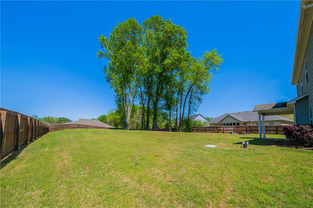 10 Edgewater Court Covington, GA 30016 - Photo 23 of 25 a view of swimming pool yard and lake view