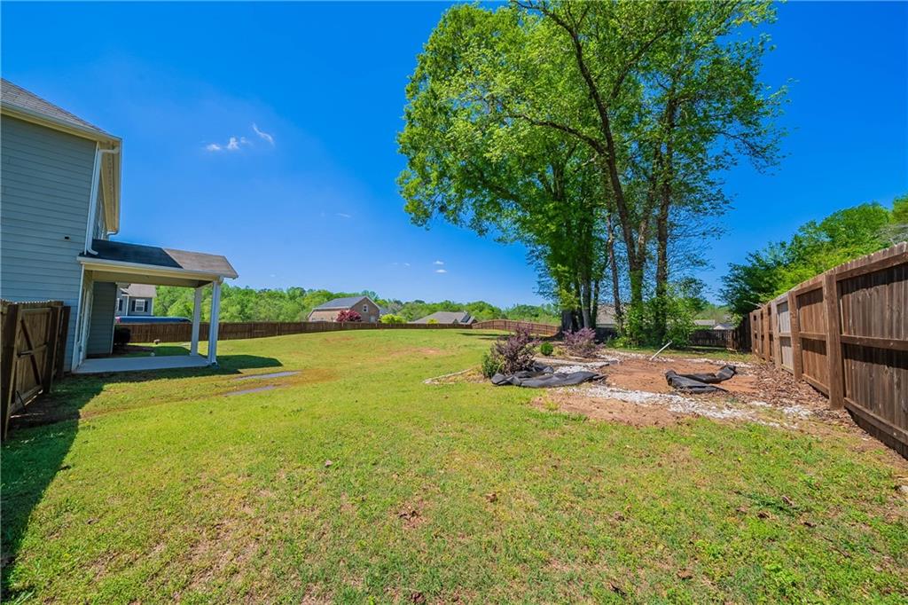 10 Edgewater Court Covington, GA 30016 - Photo 25 of 25 a view of a swimming pool with lounge chairs in patio