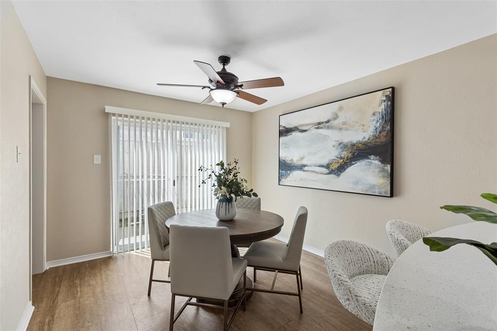 4962 Thunder Road Dallas, TX 75244 - Photo 5 of 26 Dining area featuring wood-finish flooring, a ceiling fan with integrated lighting, and neutral wall tones.