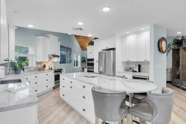 a living room with fireplace furniture and a flat screen tv