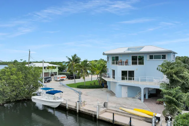a swimming pool with outdoor seating and yard