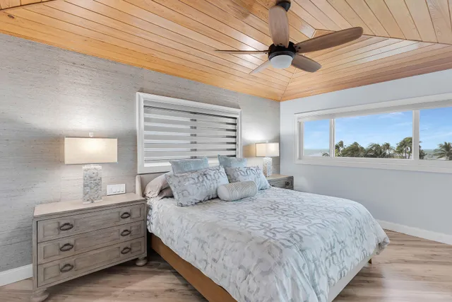 a bedroom with furniture and a flat screen tv