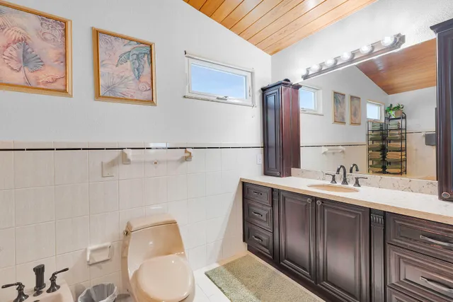 a bathroom with a shower and a sink