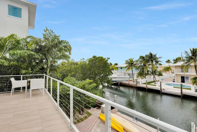 a view of a patio with couches and potted plants
