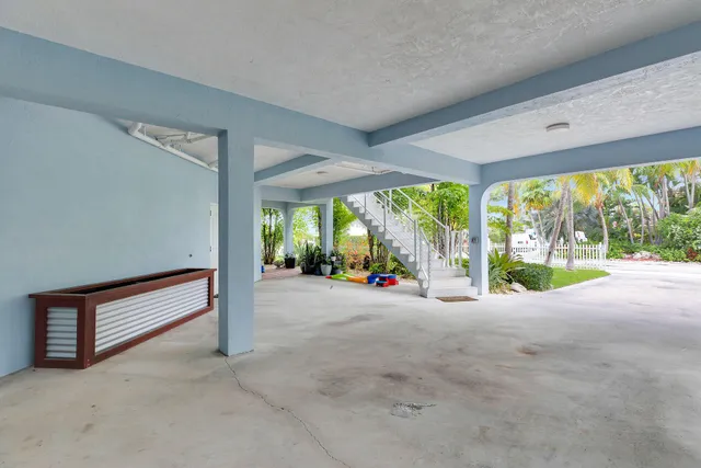 a swimming pool with outdoor seating and yard