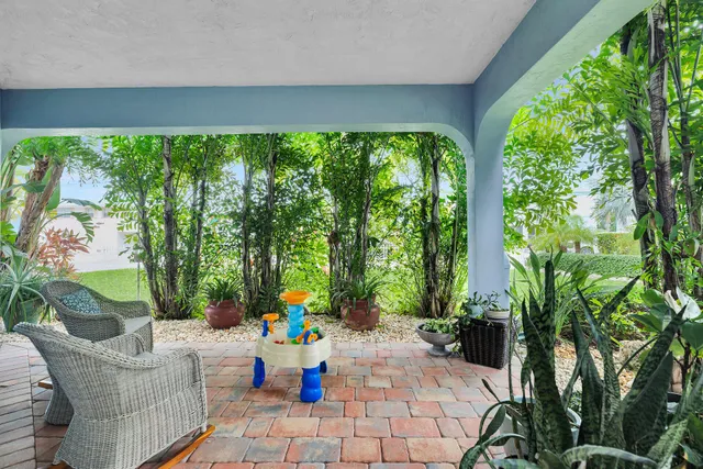 a aerial view of a house with swimming pool and a yard