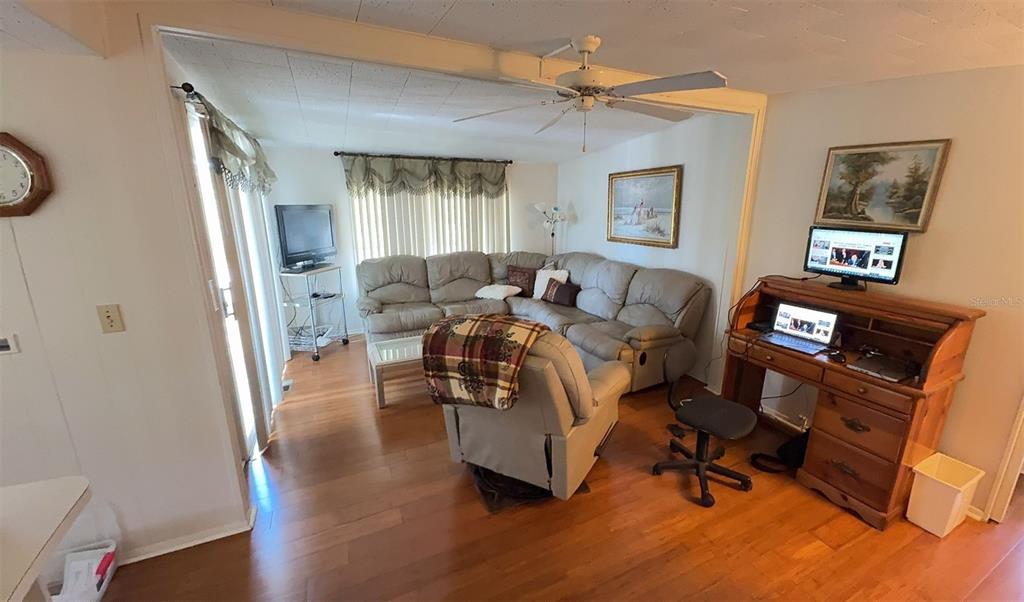 4851 West Gandy Boulevard, Unit B5L5 Tampa, FL 33611 - Photo 11 of 46 a living room with furniture and a window