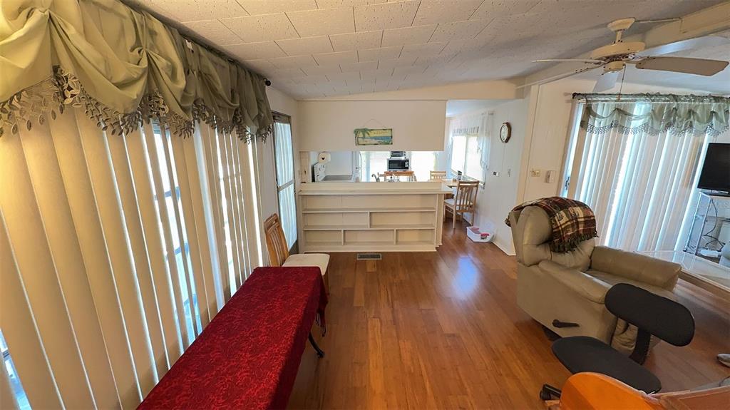 4851 West Gandy Boulevard, Unit B5L5 Tampa, FL 33611 - Photo 13 of 46 a living room with furniture and a large window