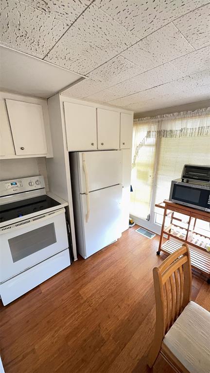 4851 West Gandy Boulevard, Unit B5L5 Tampa, FL 33611 - Photo 16 of 46 a bedroom with a bed and a window