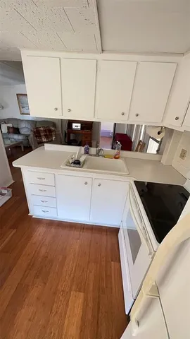 a bedroom with a bed and a lamp