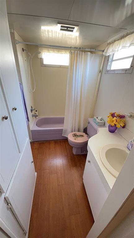 4851 West Gandy Boulevard, Unit B5L5 Tampa, FL 33611 - Photo 22 of 46 a bathroom with a sink toilet and shower