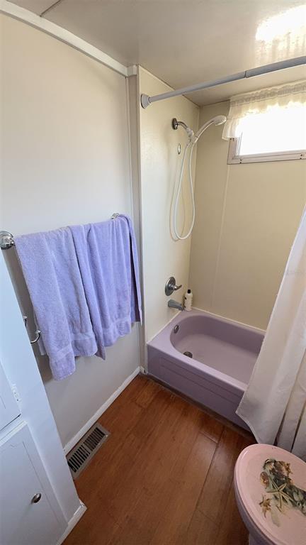 4851 West Gandy Boulevard, Unit B5L5 Tampa, FL 33611 - Photo 24 of 46 a bathroom with a tub sink and mirror