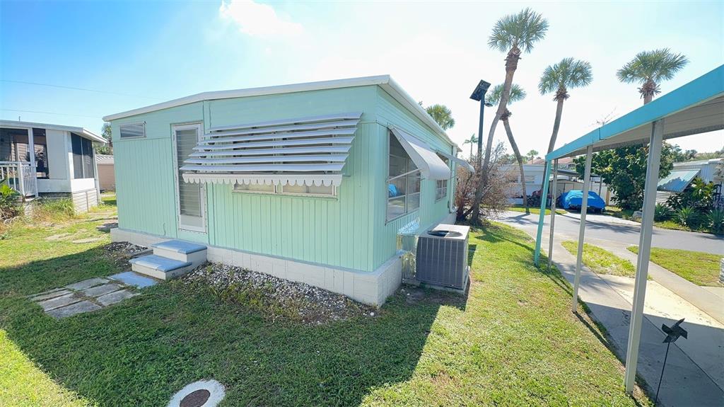 4851 West Gandy Boulevard, Unit B5L5 Tampa, FL 33611 - Photo 27 of 46 a view of a backyard with swimming pool