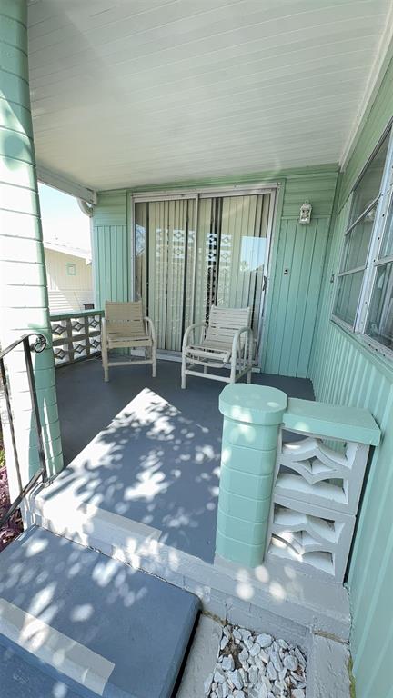 4851 West Gandy Boulevard, Unit B5L5 Tampa, FL 33611 - Photo 3 of 46 a view of a livingroom with furniture and windows