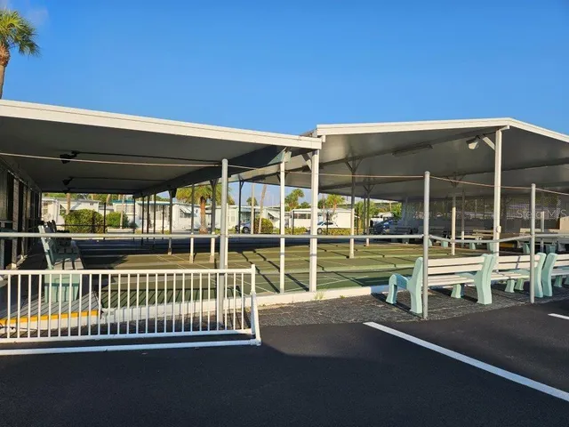 a view of swimming pool with outdoor seating